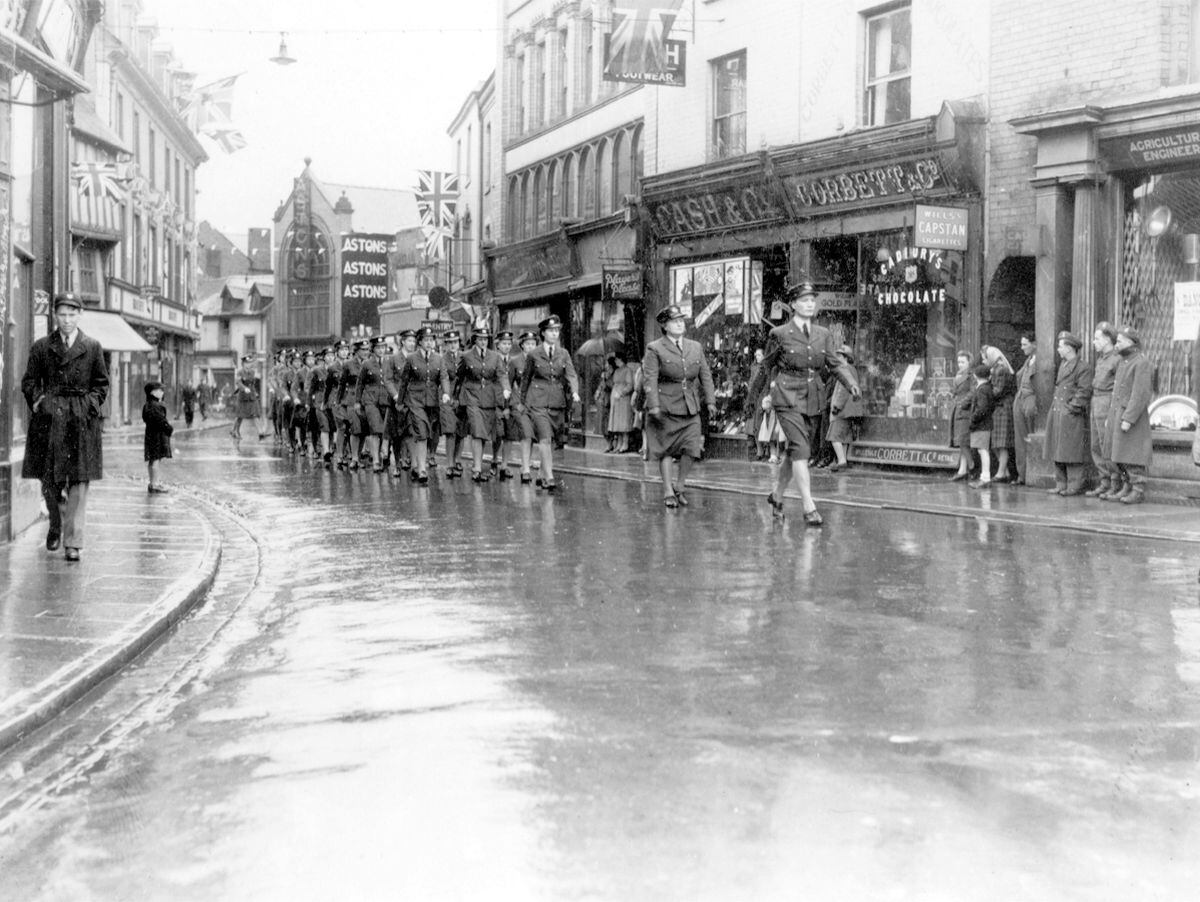 A WAAF contingent from RAF camps in and around Oswestry – they will have been principally from RAF Rednal – in a victory parade through the town. There is some discrepancy over whether this was taken on VE Day or VJ Day. That's unresolved, although May 8, 1945, was wet, and it's wet here.