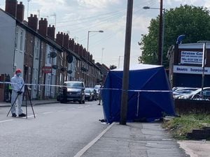 A forensic officer investigating at the scene of the stab attack in Darlaston. Picture: John Kennett