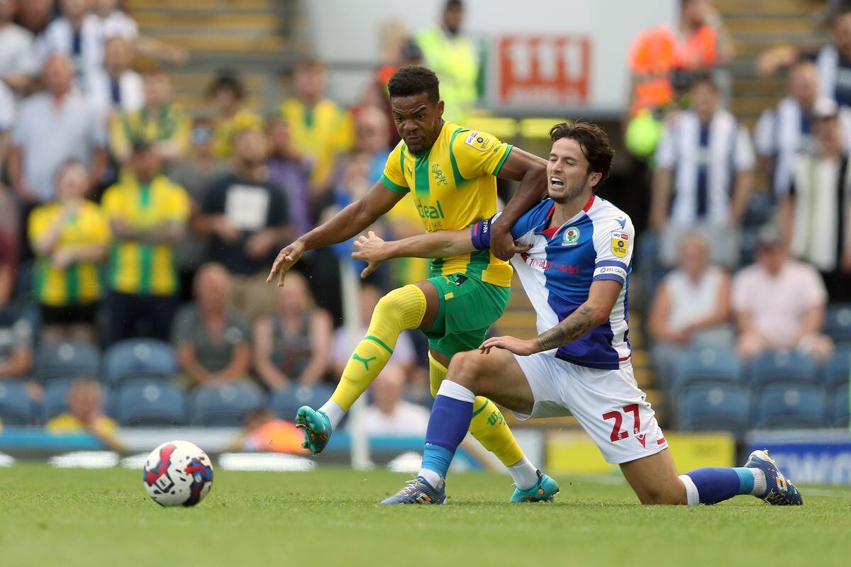 Grady Diangana of West Bromwich Albion and Lewis Travis of Blackburn Rovers  during the Sky Bet Championship between Blackburn Rovers and West Bromwich Albion at Ewood Park on August 14, 2022 in Blackburn, United Kingdom. (Photo by Adam Fradgley/West Bromwich Albion FC via Getty Images).
