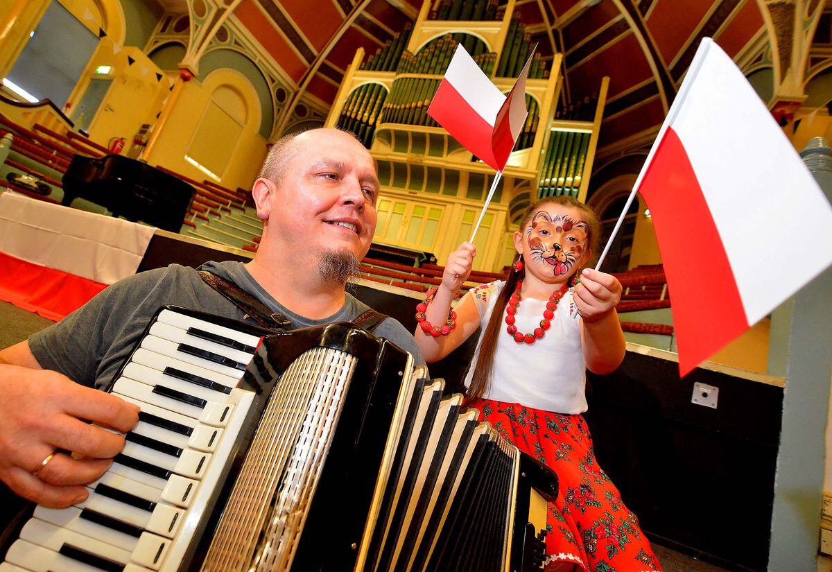 West Bromwich Town Hall and a Polish cultural event. Sylwester Rydewski and Amelia Cieslik, 7, from West Bromwich..