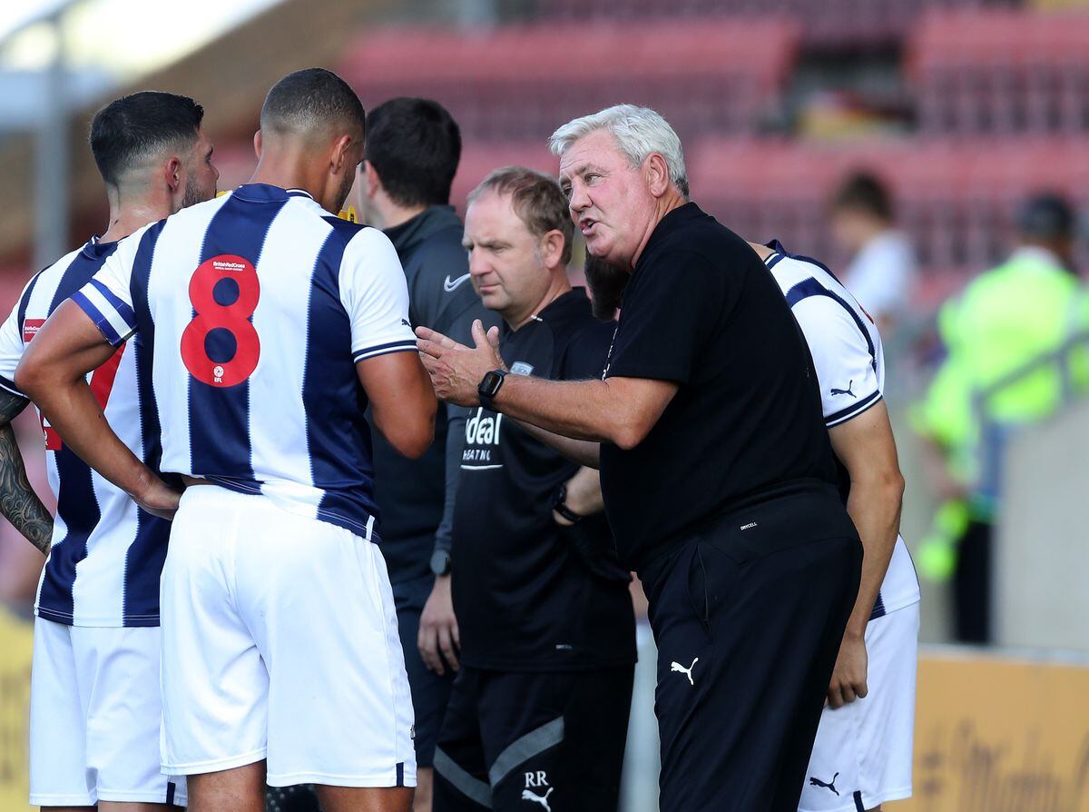 Steve Bruce speaks to his players during the second half drinks break at The Mornflake Stadium on July 16, 2022 in Crewe, England. (Photo by Adam Fradgley/West Bromwich Albion FC via Getty Images).