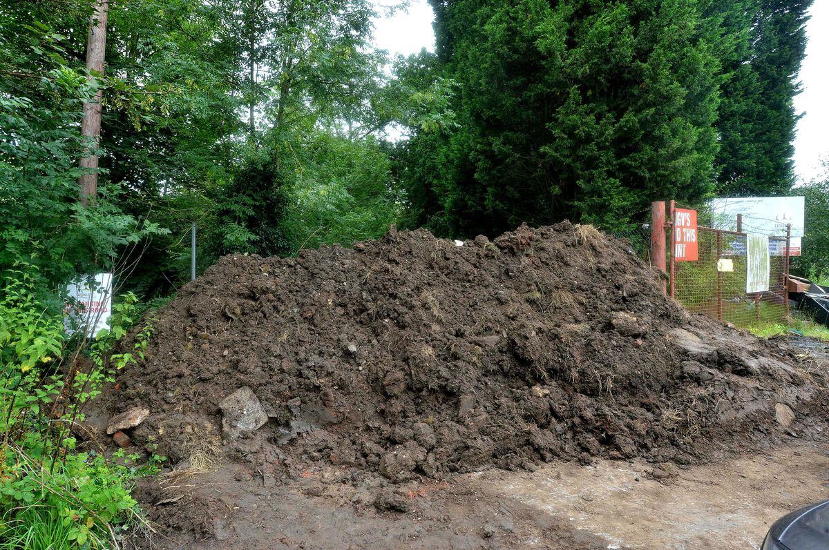 This giant mound of earth is blocking the driveway to the old pub
