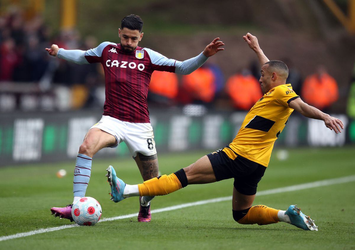 
              
Aston Villa's Morgan Sanson and Wolverhampton Wanderers' Marcal (right) battle for the ball during the Premier League match at the Molineux Stadium, Wolverhampton. Picture date: Saturday April 2, 2022. PA Photo. See PA story SOCCER Wolves. Photo credit should read: Isaac Parkin/PA Wire.


RESTRICTIONS: EDITORIAL USE ONLY No use with unauthorised audio, 
video, data, fixture lists, club/league logos or "live" services. Online in-match use limited to 120 images, no video emulation. No use in betting, games or single club/league/player publications.
            
