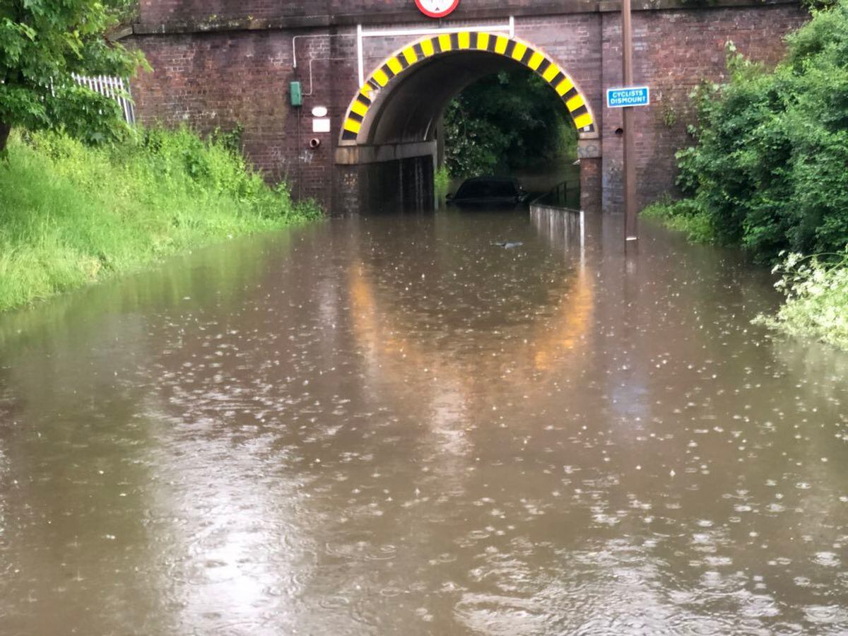 A driver had to be rescued after a car was submerged in flooding under Greenfield Lane railway bridge. Picture: @stephenlapper 