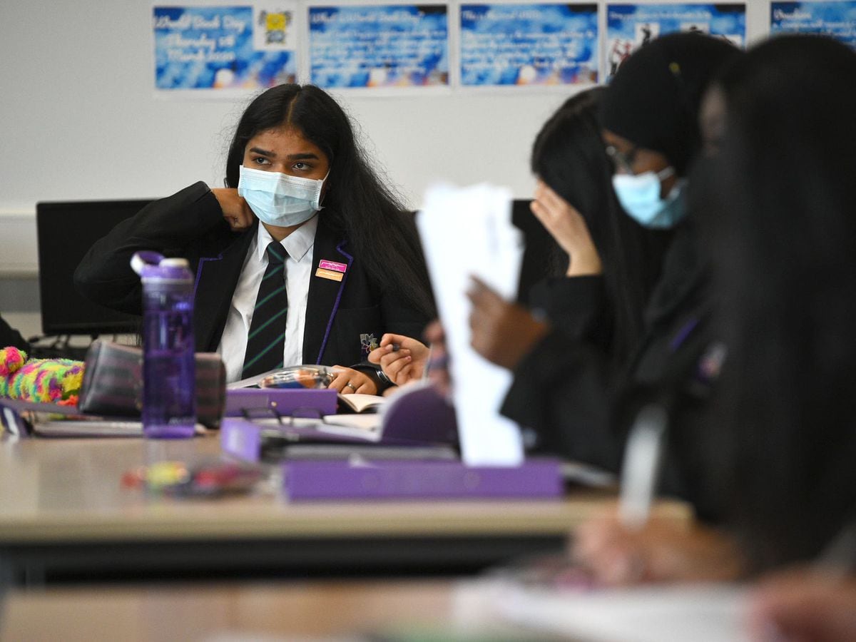 Children wearing facemasks during a lesson at Hounslow Kingsley Academy in West London (Kirsty O'Connor/PA)