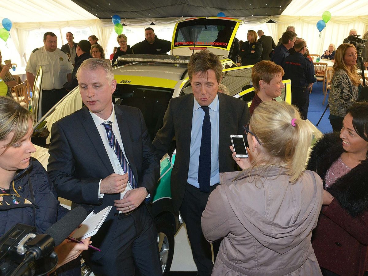 CANNOCK STEVE LEATH COPYRIGHT EXPRESS AND STAR 02/05/2014  Hugh Grant at Buntwood Rugy Club at Community First Responders Car launch.  On the left of Hugh is Paul Dadge (check spelling) friend of Hugh's..