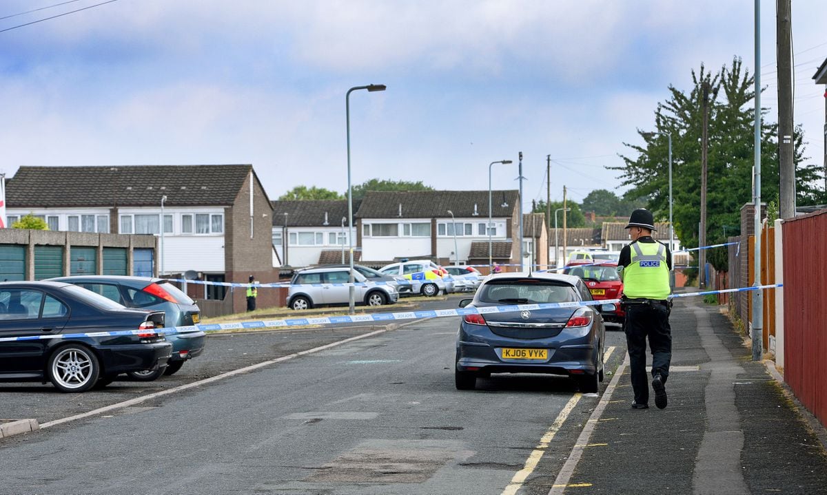 Police cordoned off the scene of the fatal shooting in Village Road 