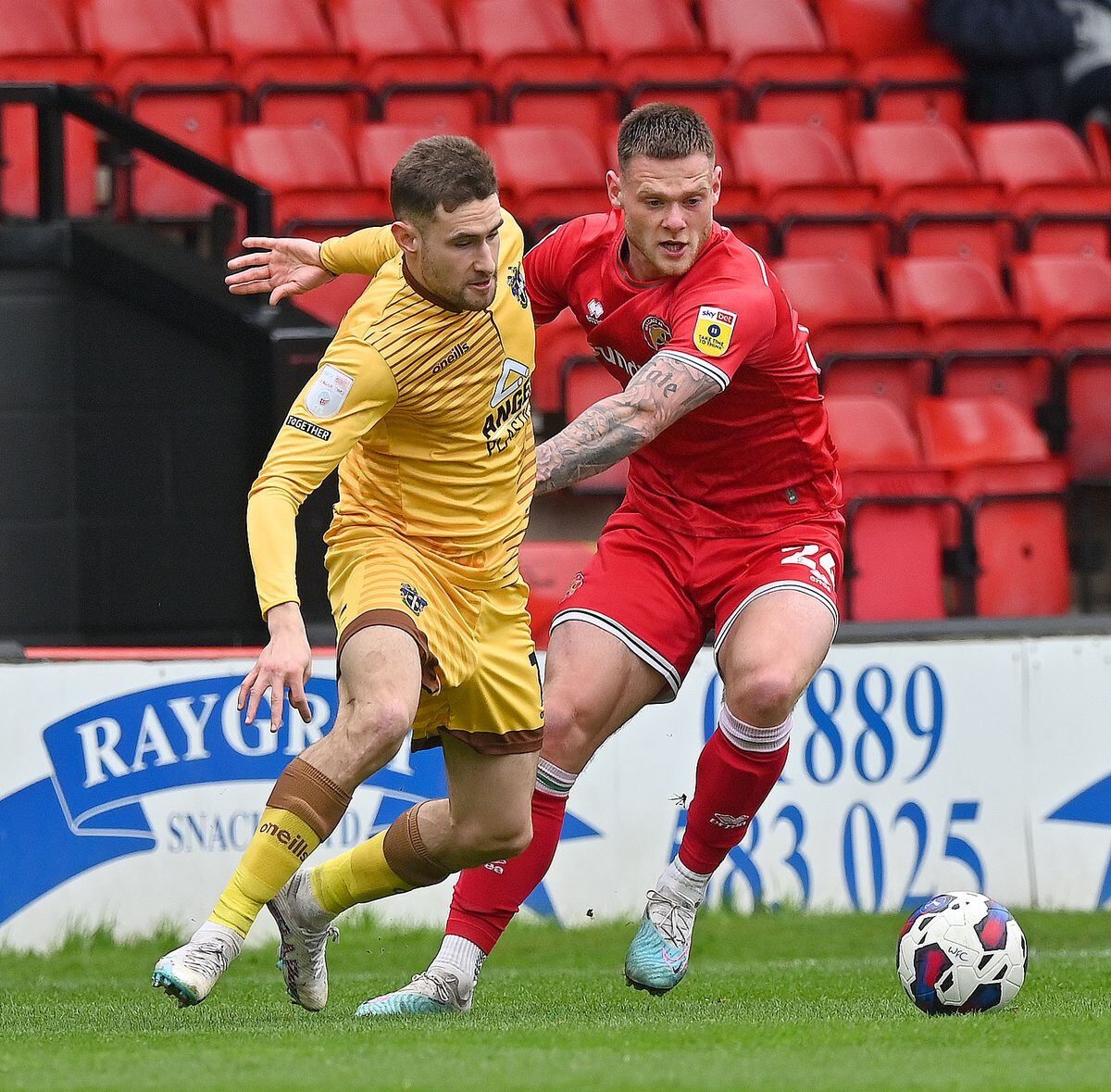 Walsall's Joe Low and Suttons Will Randall