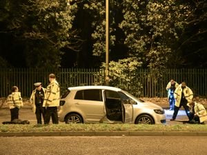 Police examining the silver VW Golf Plus after a teenager was hit by a car in Queslett Road, Great Barr. Photo: SnapperSK