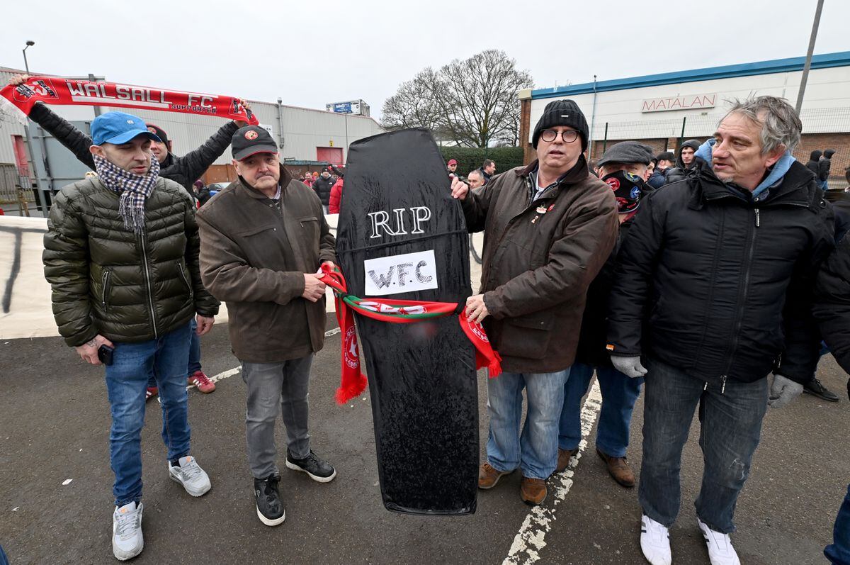 Walsall fans protest about the board at Banks's Stadium