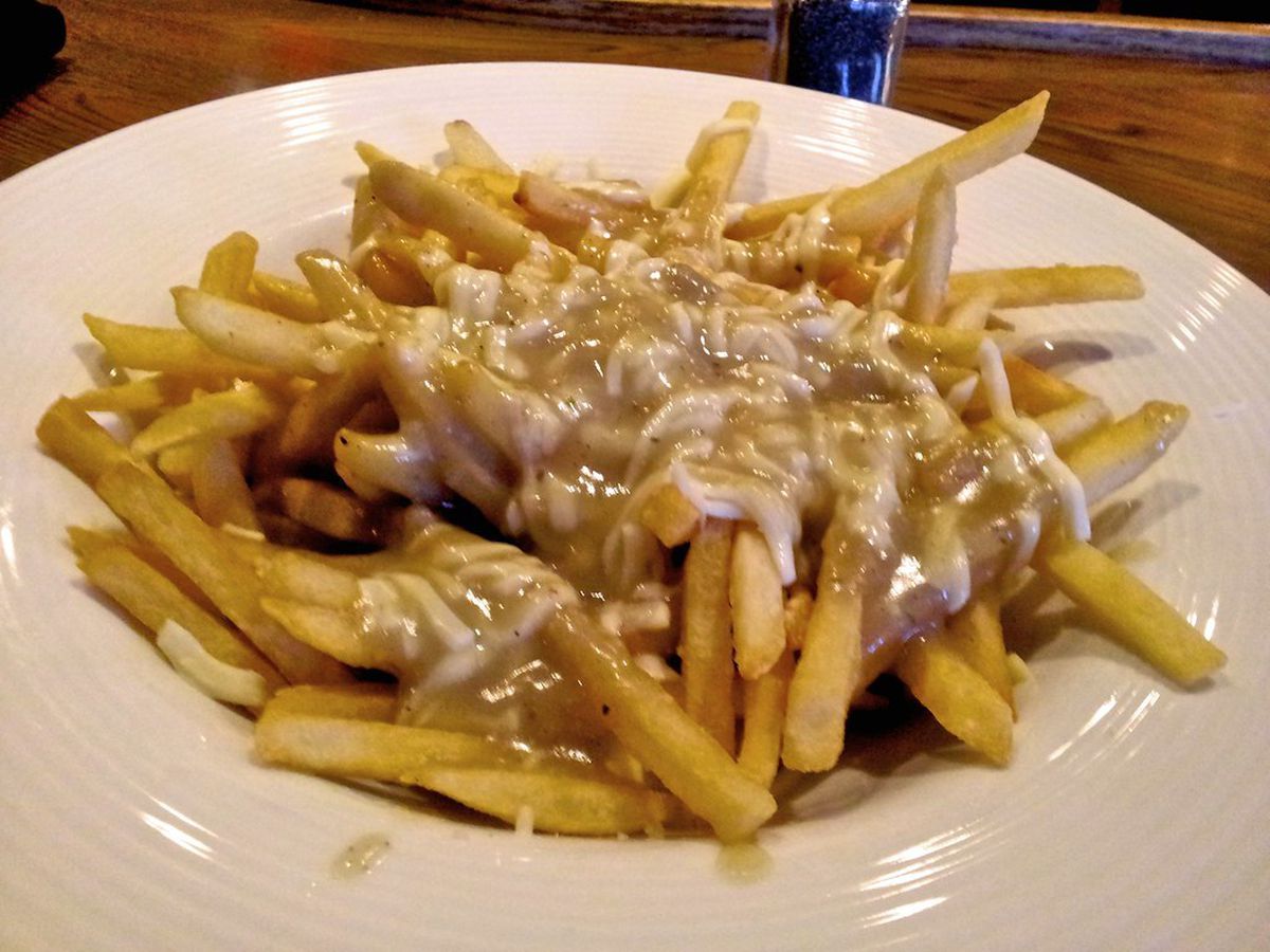 Poutine combines cheese curds, french fries and gravy for a typically Canadian dish