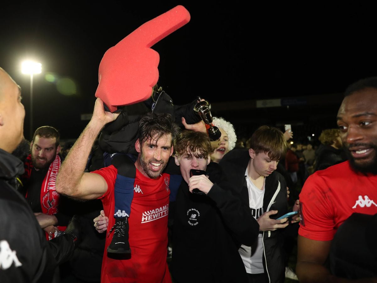 Fans celebrate with Kidderminster Harriers' Mark Carrington after the Emirates FA Cup third round match at the Aggborough Stadium, Kidderminster. Photo: Bradley Collyer/PA Wire