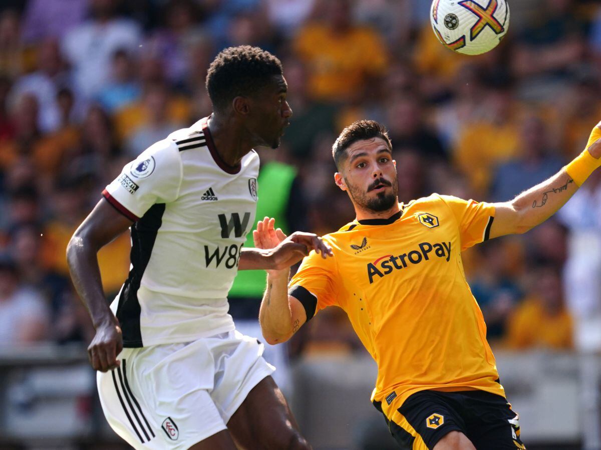 
              
Wolverhampton Wanderers' Pedro Neto and Fulham's Tosin Adarabioyo battle for the ball during the Premier League match at the Molineux Stadium, Wolverhampton. Picture date: Saturday August 13, 2022. PA Photo. See PA story SOCCER Wolves. Photo credit should read: David Davies/PA Wire.


RESTRICTIONS: EDITORIAL USE ONLY No use with unauthorised audio, 
video, data, fixture lists, club/league logos or "live" services. Online in-match use limited to 120 images, no video emulation. No use in betting, games or single club/league/player publications.
            
