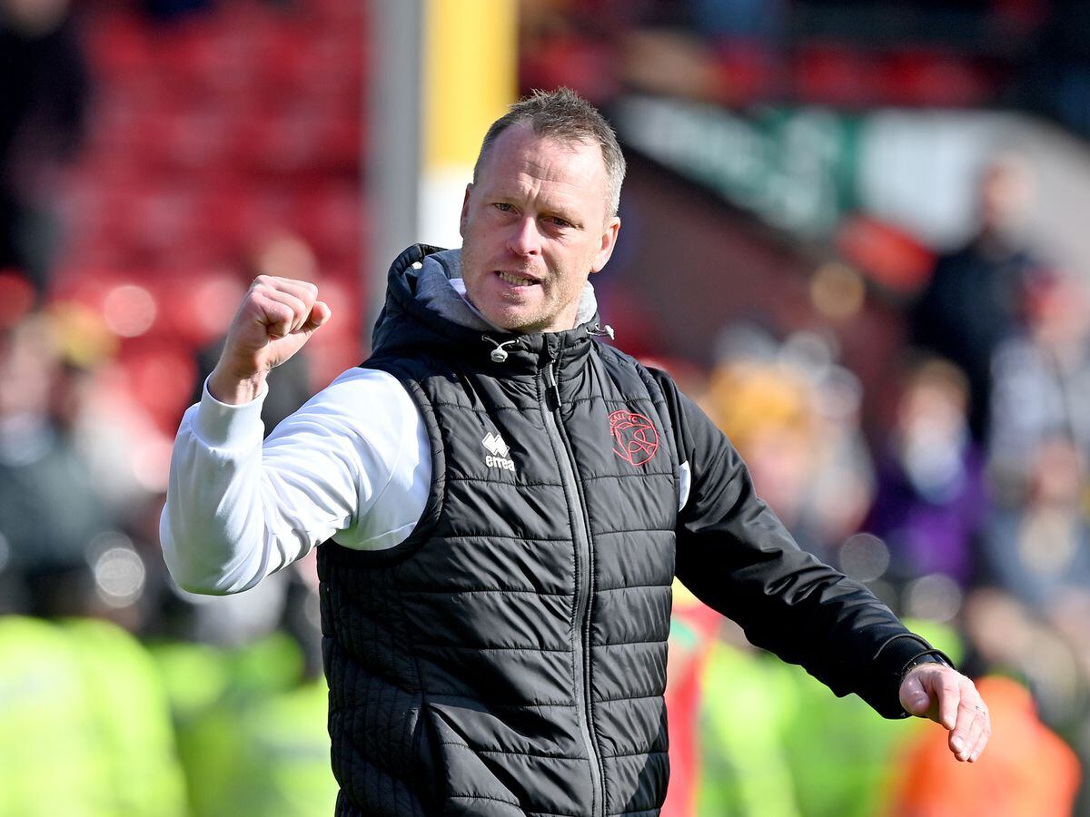Walsall head coach Michael Flynn punches the air after the Saddlers win