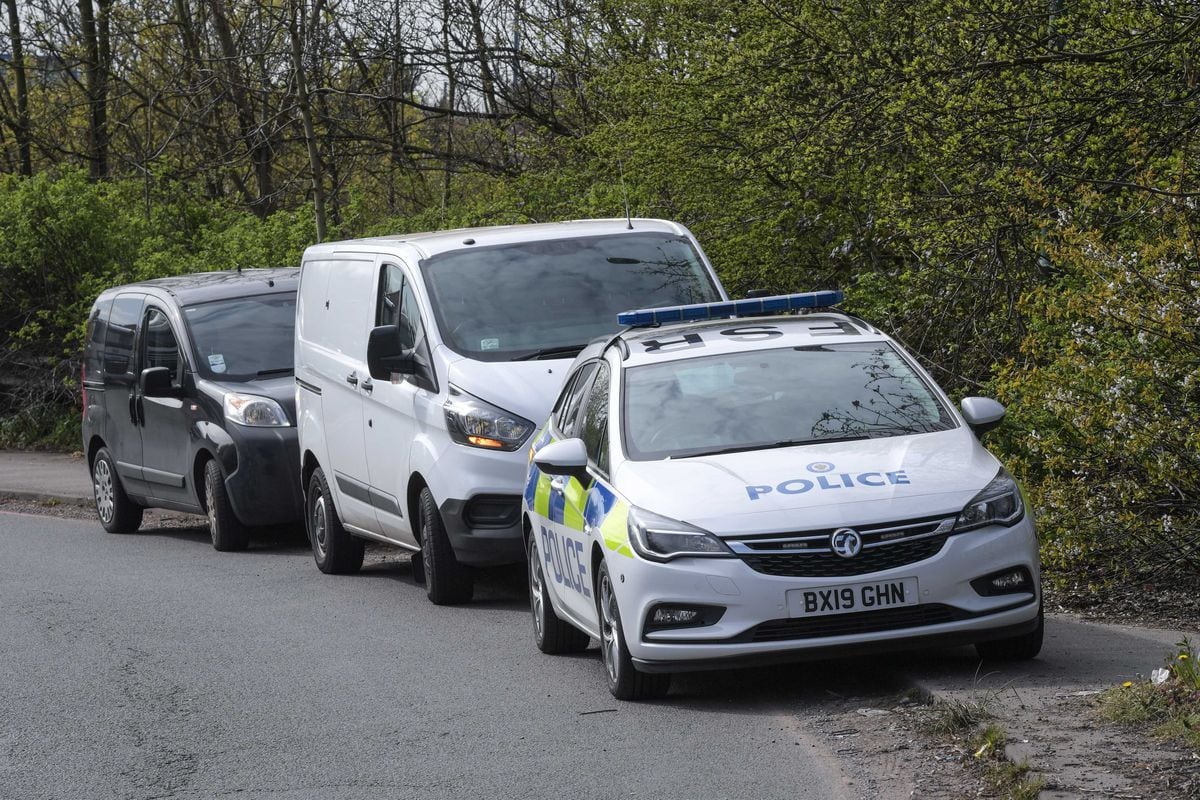 Police at the scene next to Junction 9 of the M6 where human remains were found. Photo: SnapperSK