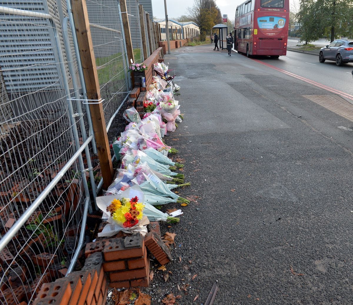 SANDWELL COPYRIGHT TIM STURGESS EXPRESS AND  STAR...... 22/11/2022   Flowers at the scene where a blue Nissan Skyline hit a number of pedestrians who had gathered on the A457 Birmingham Road and Oldbury Road near to the junction with Crystal Drive....