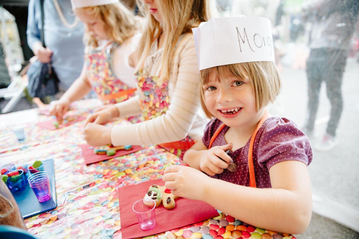 Morgan Bailey, aged four, decorates a gingerbread at Market Drayton's Ginger and Spice Festival 