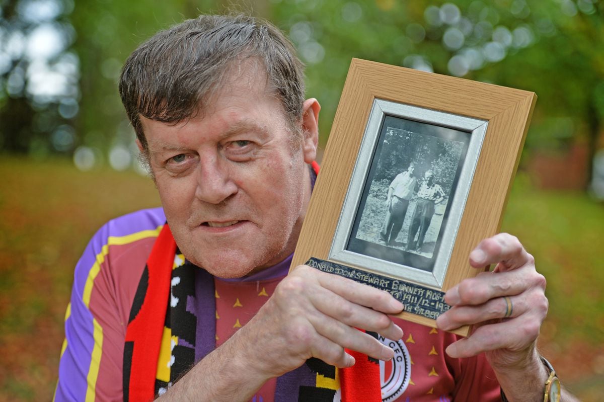 Paul Bennett, holding a photograph of his grandfather Don. Paul is trying to find what happened to the body of his great uncle Gordon "Dusty" Bennett, who was killed in the Spanish Civil War