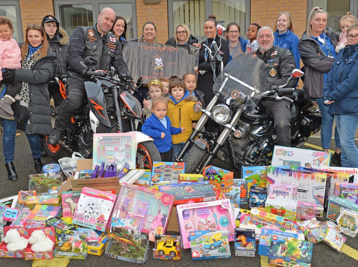 Bikers Rob Trotter, left, and Andrew Campbell with staff and children at Low Hill Primary School 