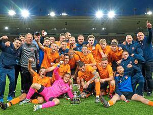 Lichfield City celebrate with the JW Hunt Cup on the Molineux pitch after overcoming Tividale      Picture: Nigel Cliff