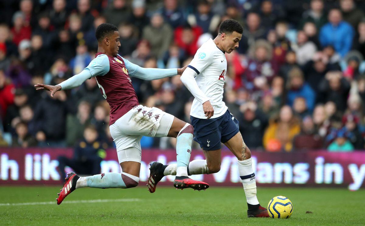 Aston Villa's Ezri Konsa (left) and Tottenham Hotspur's Dele Alli battle for the ball 