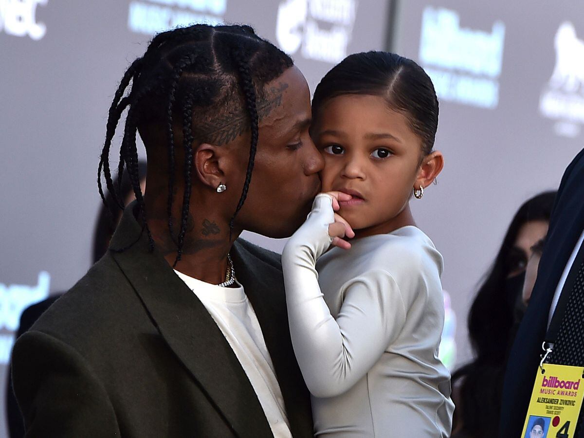 Travis Scott, left, and daughter Stormi Webster arrive at the Billboard Music Awards on Sunday, May 15, 2022, at the MGM Grand Garden Arena in Las Vegas