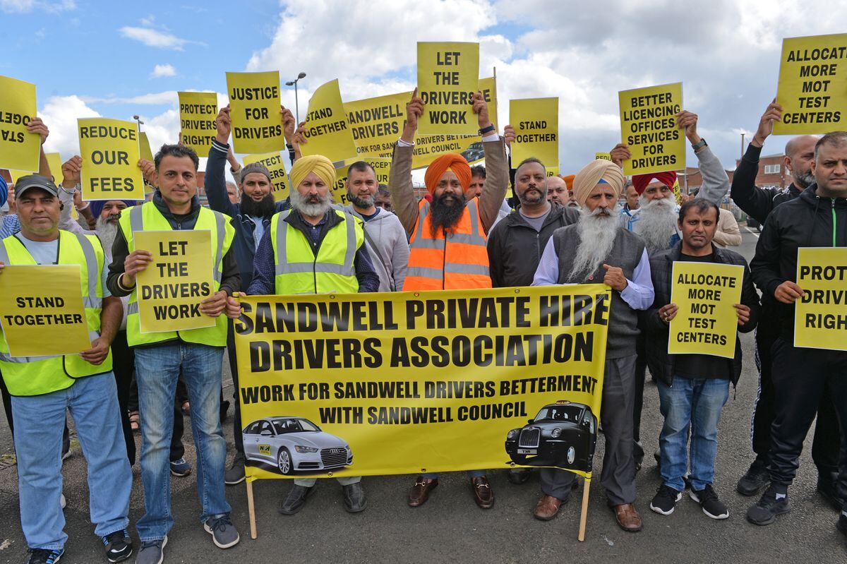 Taxi drivers prepare for their march in Spon Lane, West Bromwich 