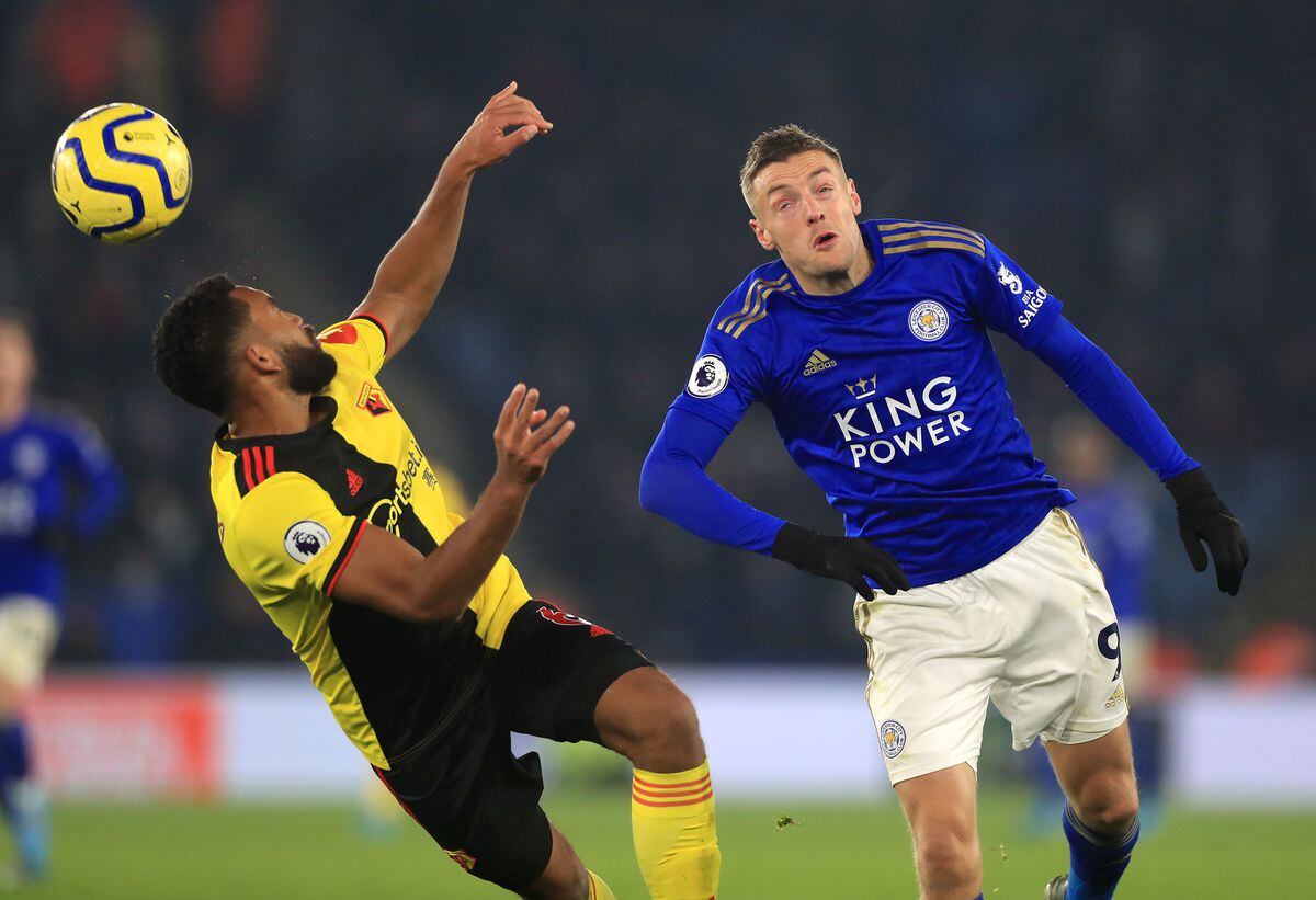               Watford's Adrian Mariappa (left) Leicester City's Jamie Vardy battle for the ball during the Premier League match at King Power Stadium