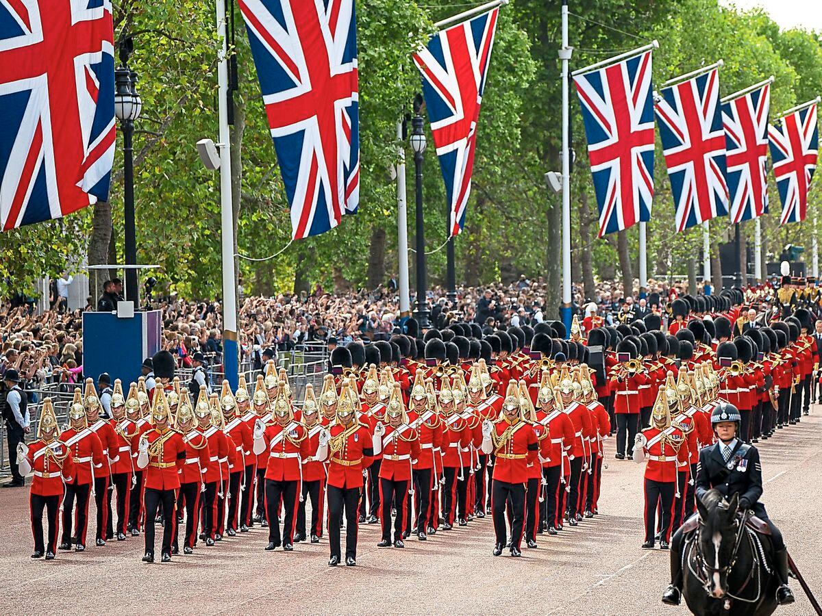 The military procession as the coffin of Queen Elizabeth II was carried on a horse-drawn gun carriage during the ceremonial procession from Buckingham Palace to Westminster Hall