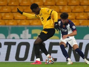 Michael Agboola of Wolverhampton Wanderers and Jamie Soule of West Bromwich Albion at Molineux on November 5, 2021 in Wolverhampton, England. (Photo by Adam Fradgley/West Bromwich Albion FC via Getty Images).