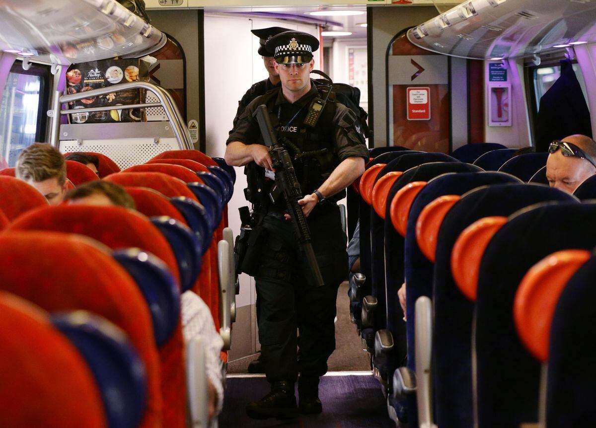 Transport police counter-terrorism officers on board a train earlier this year. 