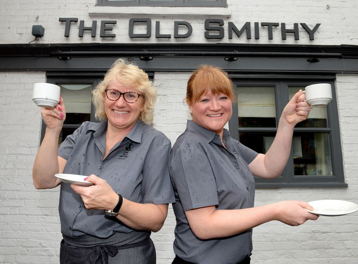Restaurant supervisor Claire Harper and owner Charlotte King enjoy a cup of tea as they take part in Macmillans coffee morning at The Old Smithy, Eccleshall