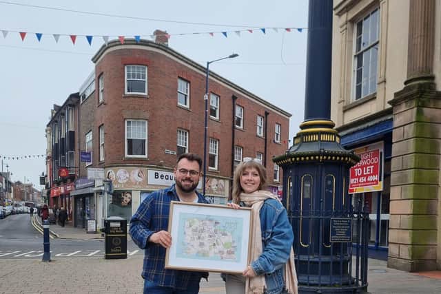 Cllr Andrew Tromans and Stourbridge-based artist Stacy Hammond holding the sought-after larger prints of the music map.