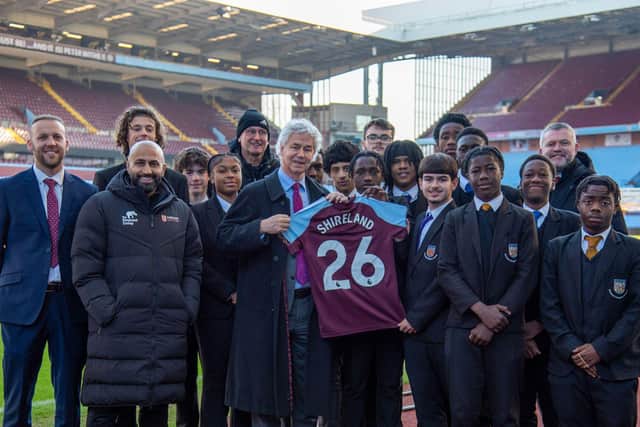 Staff and students from Shireland Collegiate Academy celebrates the launch of their new partnership with the Aston Villa Foundation.