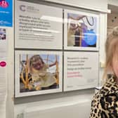 Wendie-Lou in front of her poster at the Bromsgrove Cancer Research UK shop