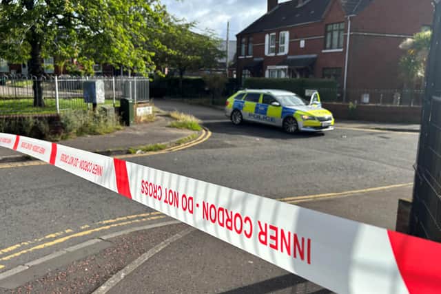 A police cordon at the scene of a stabbing outside apartments in the Kinnaird Avenue area of north Belfast