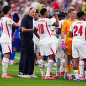 NOW HEAR THIS: England manager Thomas Tuchel chats with Jude Bellingham during the hydration break in the World Cup clash against Croatia in Dallas. Picture: Bradley Collyer/PA