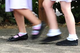 A generic stock photo of school girls walking to school.